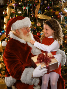 Girl Sitting with Santa Claus